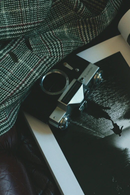 a pograph of a person's leg on their legs and a gun lying on the ground