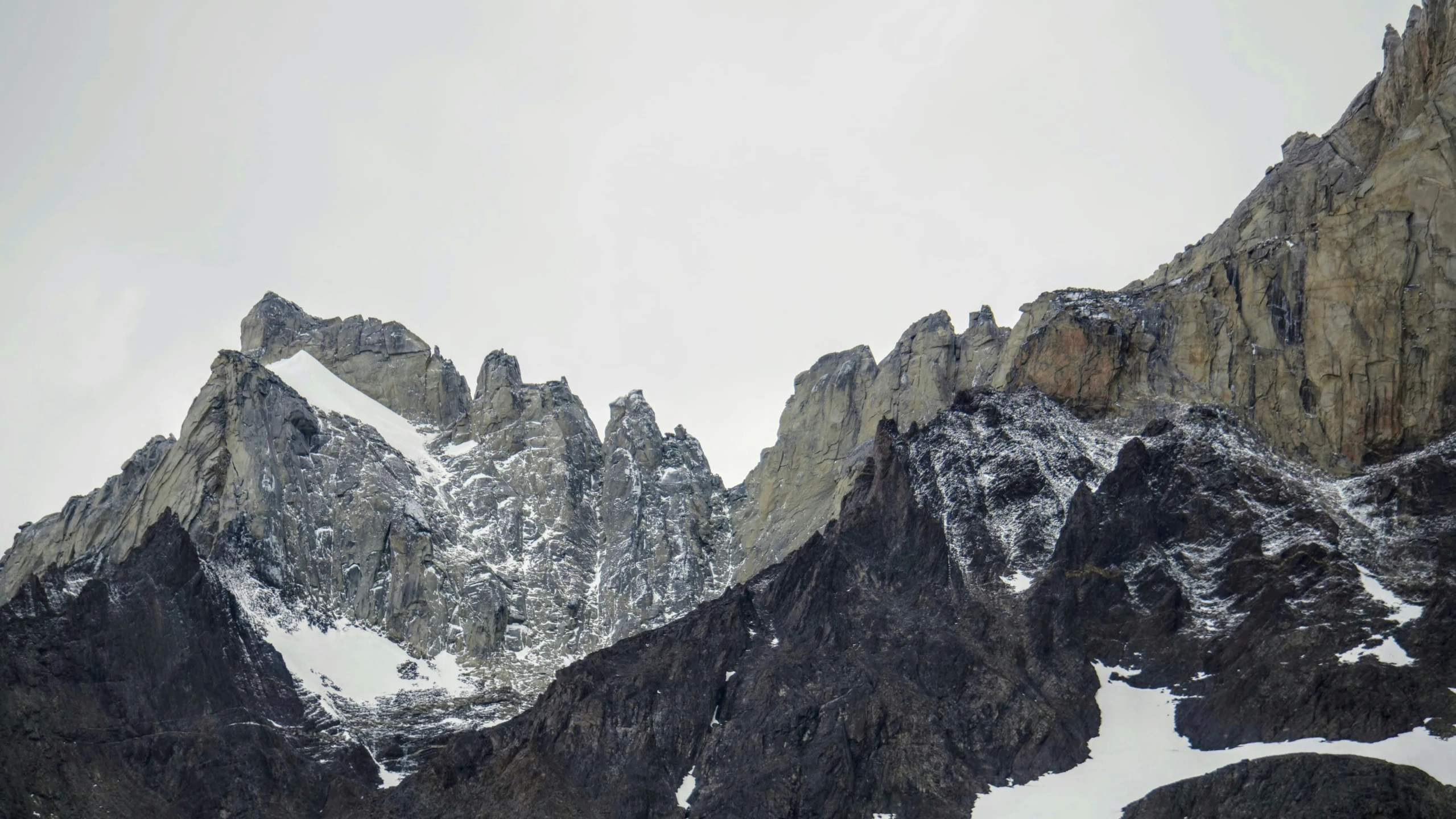 a couple of large mountains that have snow on them