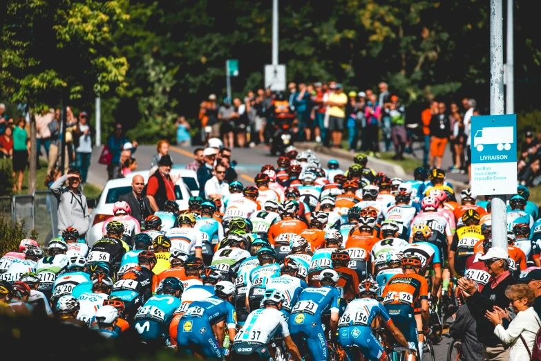 many people and bicycles lined up on the road