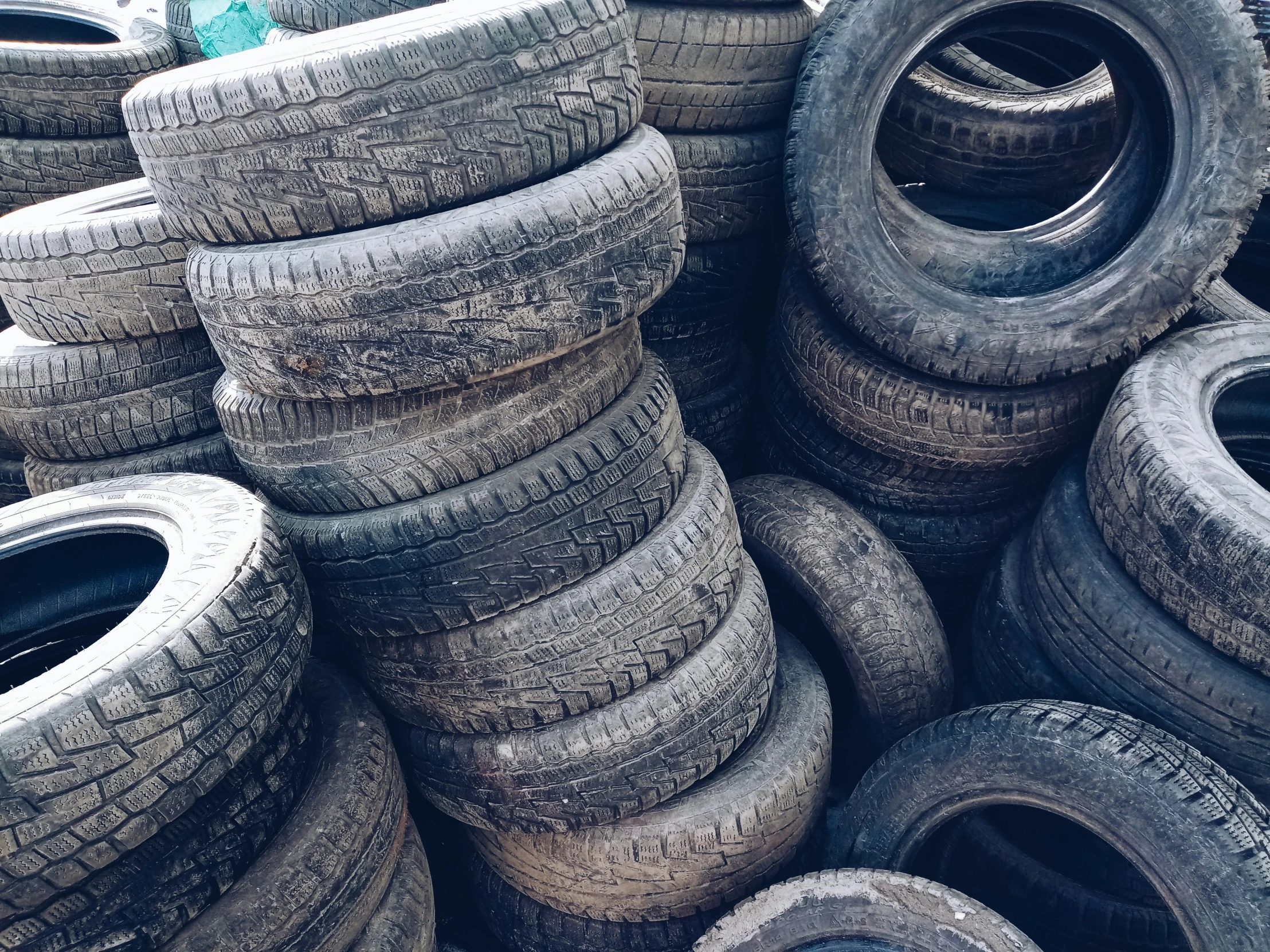 large pile of tires laying on top of each other