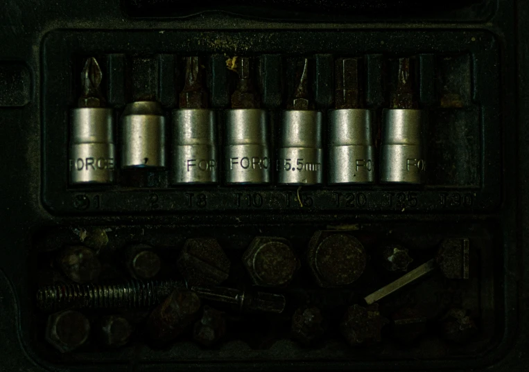 many metal items and tools are in a case