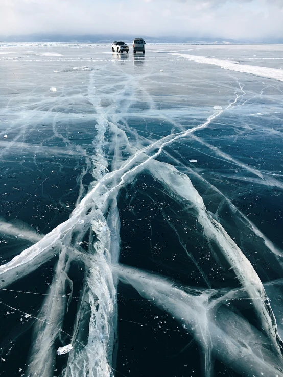 there is a boat moving through the ice