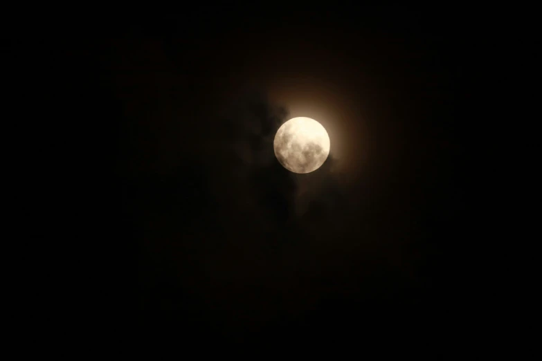 a partial view of the moon in the night sky