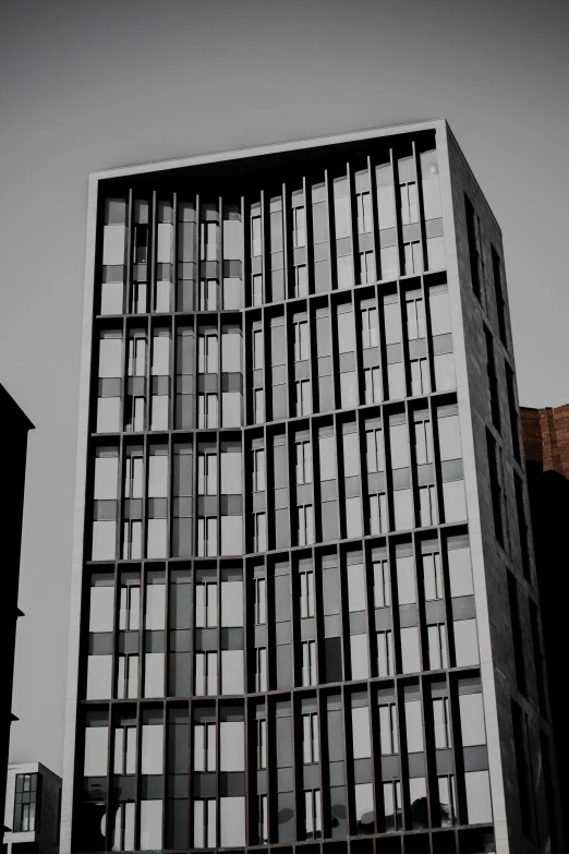 a tall building with many windows on the top