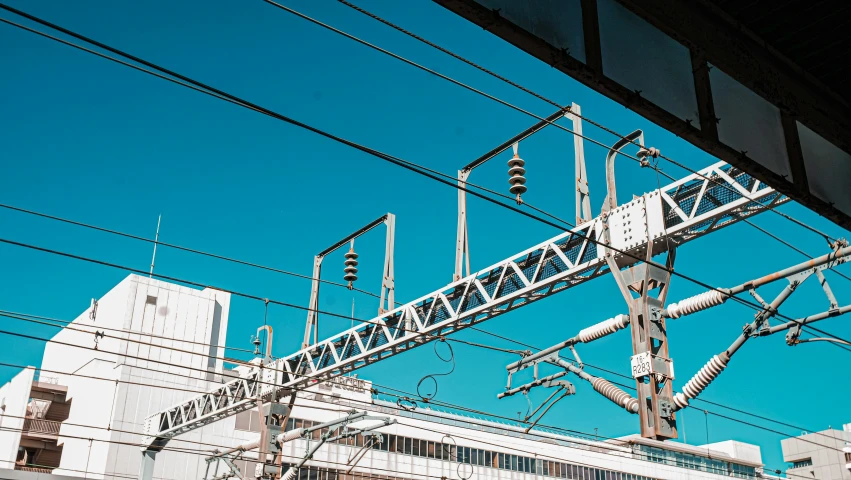 some electrical wires and cables on top of a building