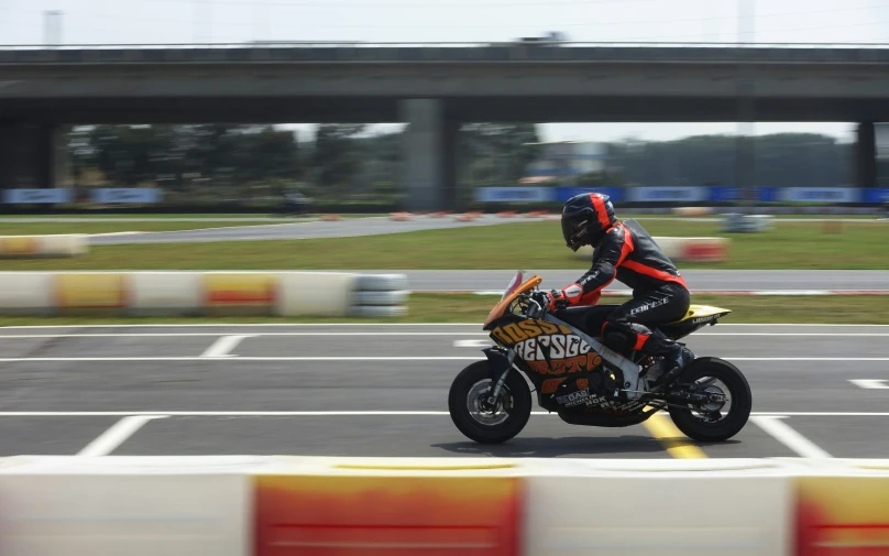 the man is riding on his motorcycle in the open field