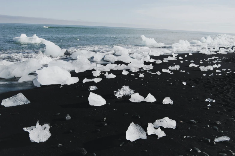 rocks and sea ice are on the beach