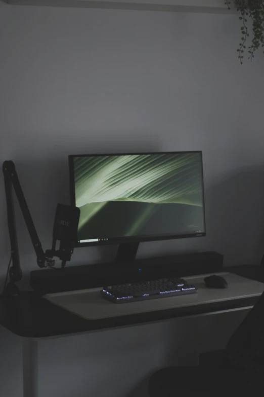 computer monitor on a desk in front of the lights