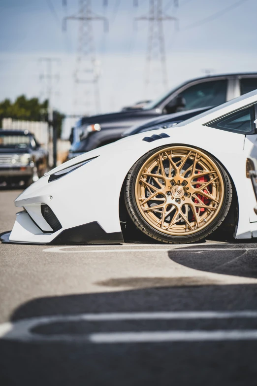 a white sports car is parked on the street