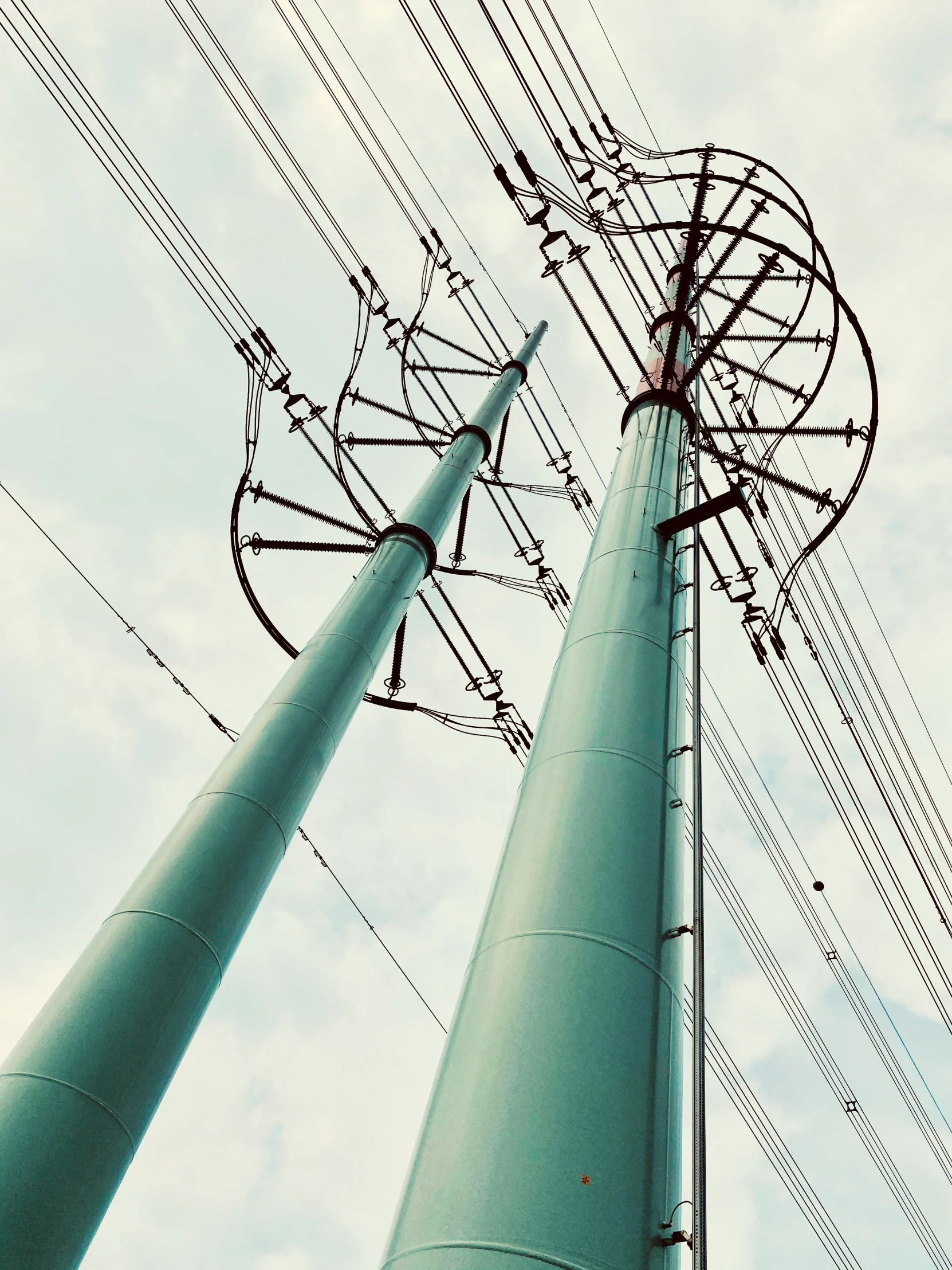 several wires are connected to a pole outside