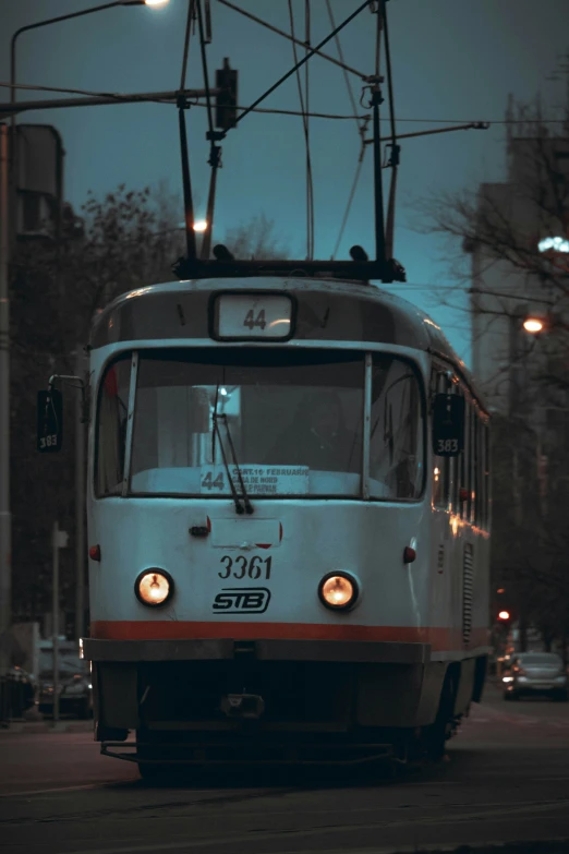 a light rail car moving through the city