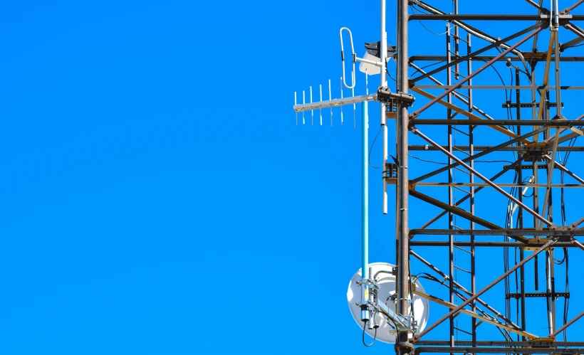 a large cellular tower and cell phone booth