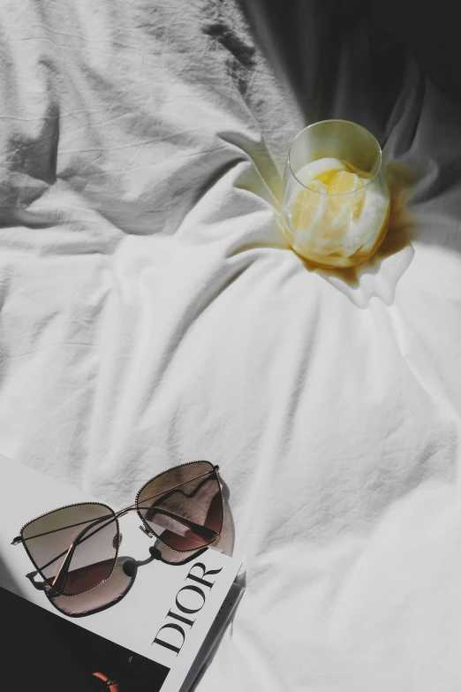 a po of some sunglasses on a white sheet