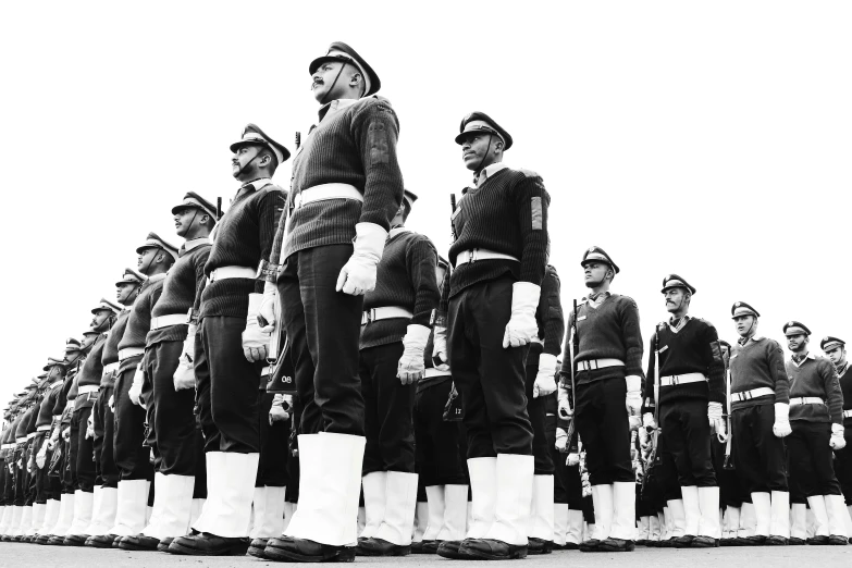 a large group of men and women with a line of them in uniform