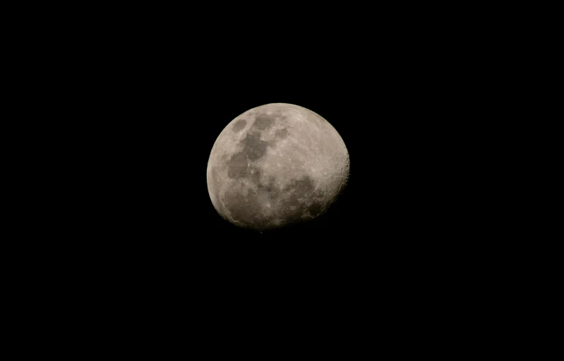 a black - and - white image of a half - moon is seen