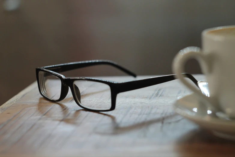 a close up of a pair of glasses on a table