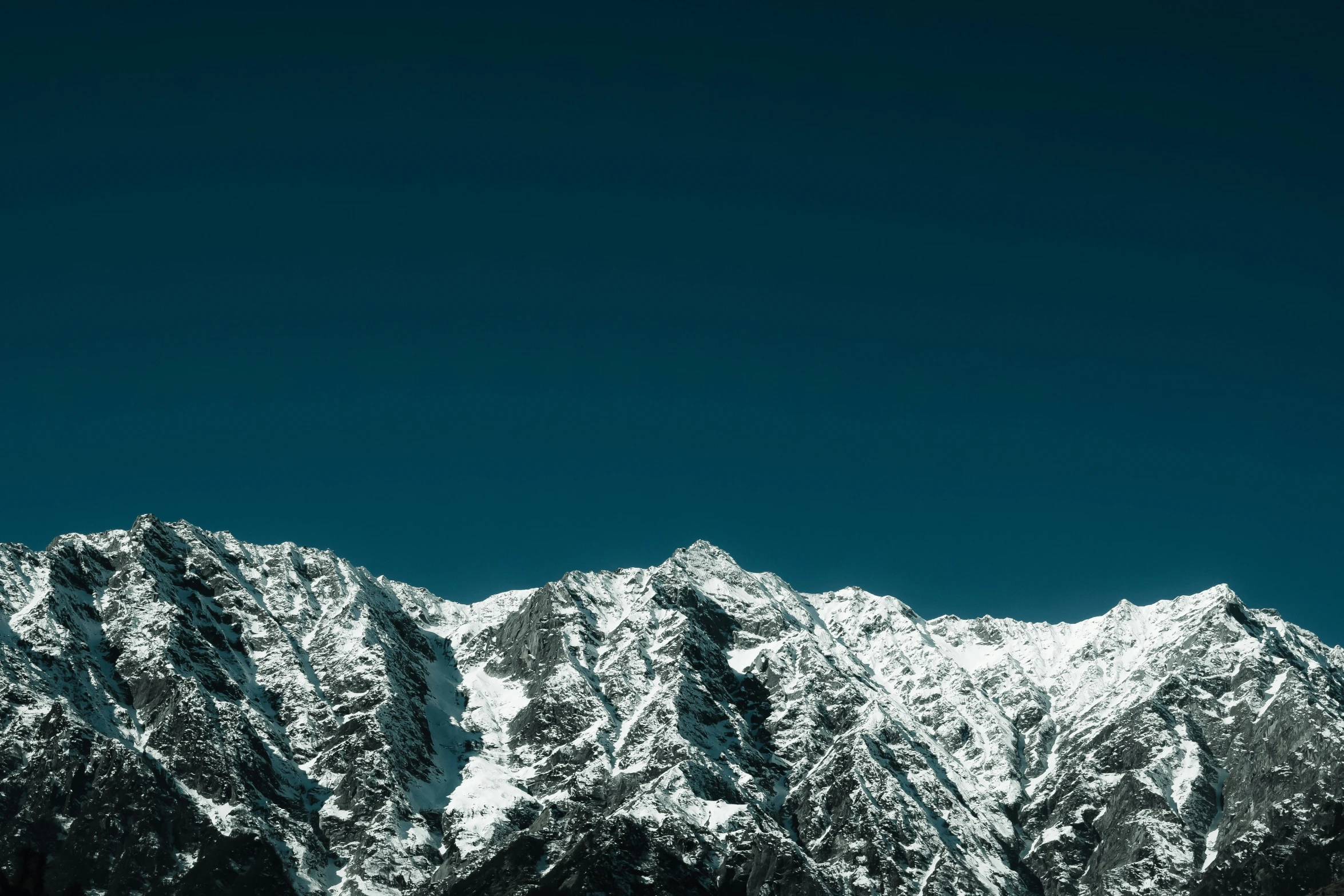 mountains with a snow - capped peak are seen in this po