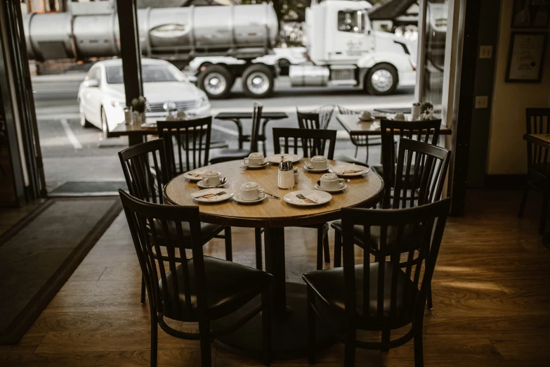 an image of a restaurant setting with a view of the city street