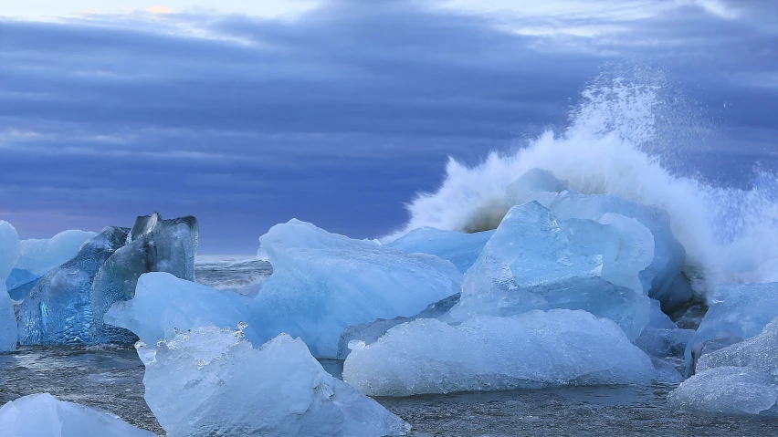 a close up of ice blocks on the beach