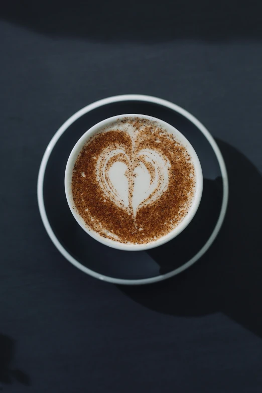 a plate with a heart on top and a drink