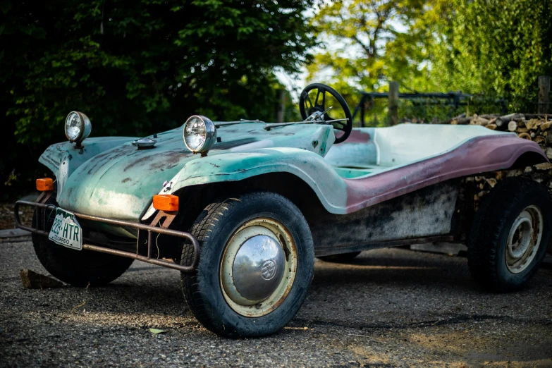 an old car is parked in the lot