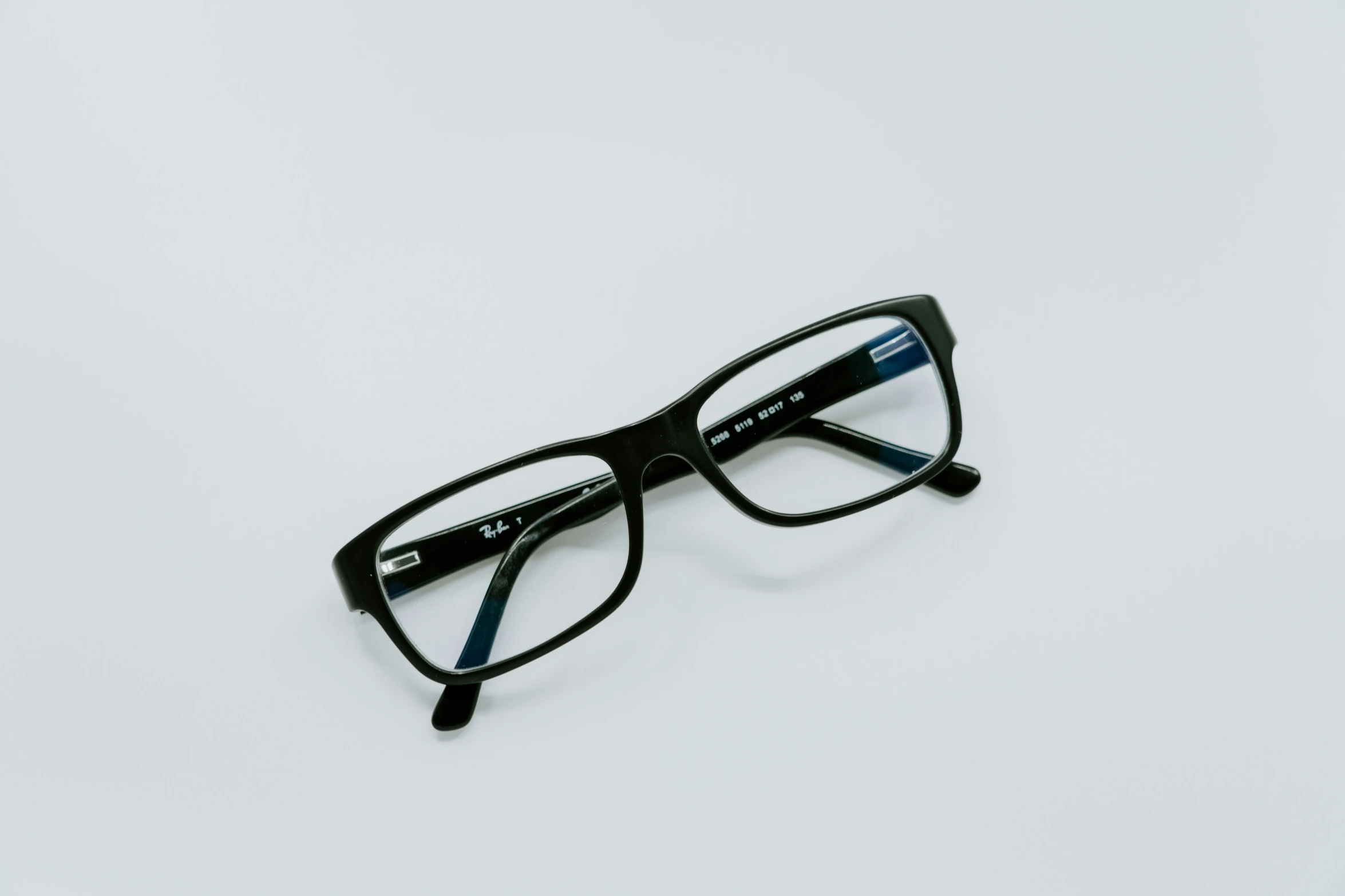 a black eyeglasses is shown against a white background