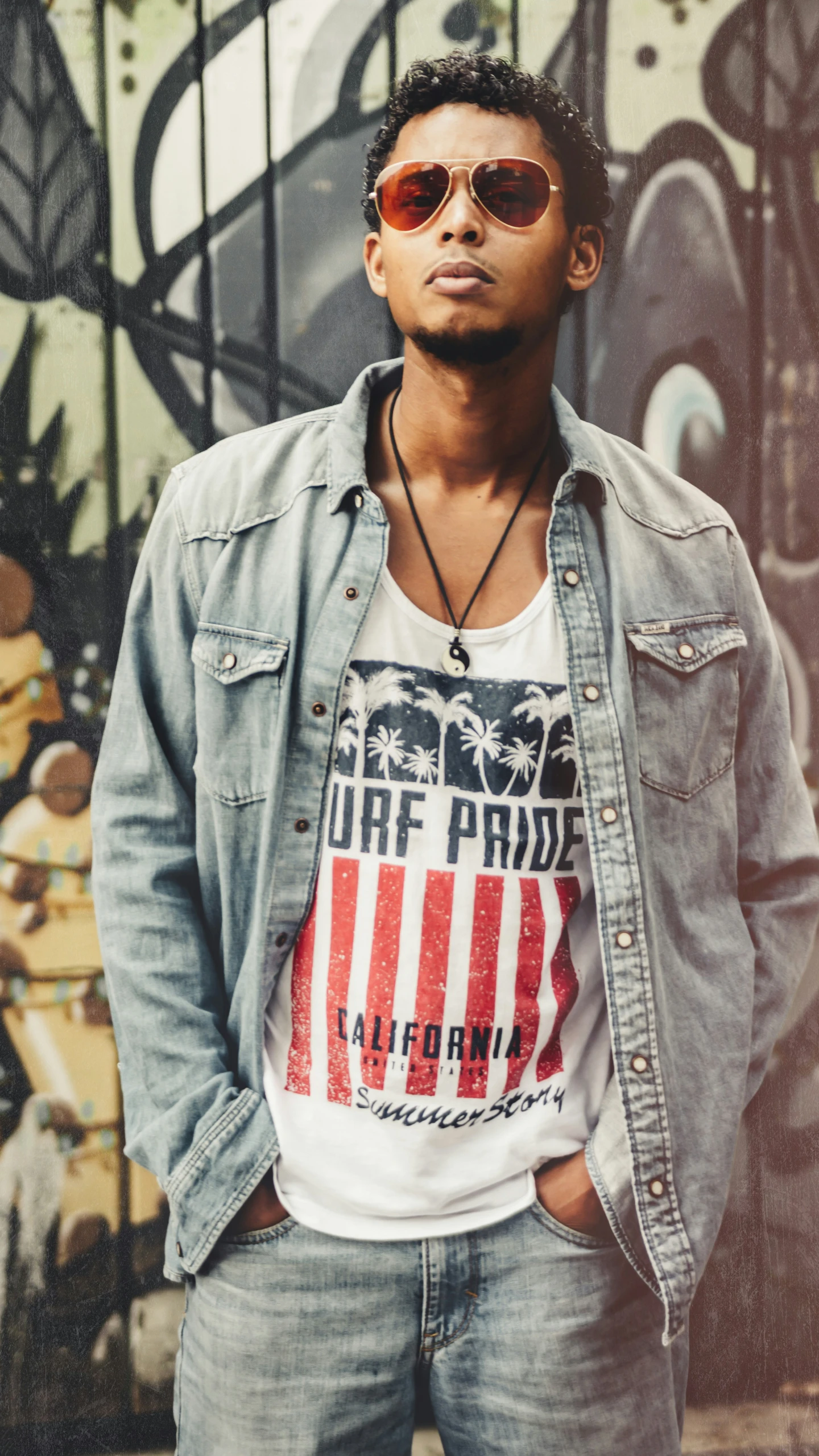 a man in glasses and a white shirt wearing an american flag t - shirt