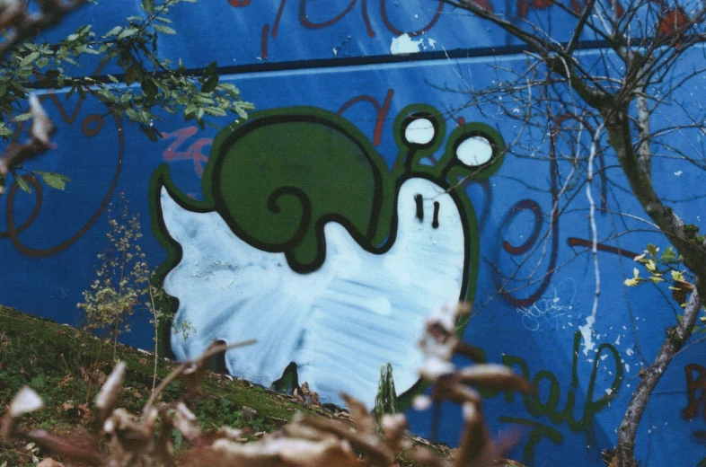 a grafitti style ghost in the middle of a field