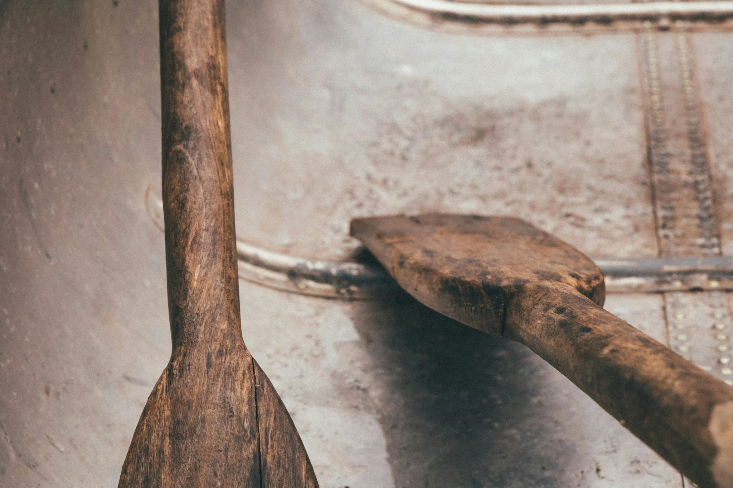 a wooden spoon sitting on top of a metal counter