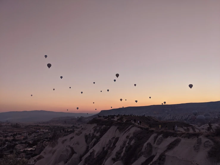 a view of a sunset of  air balloons