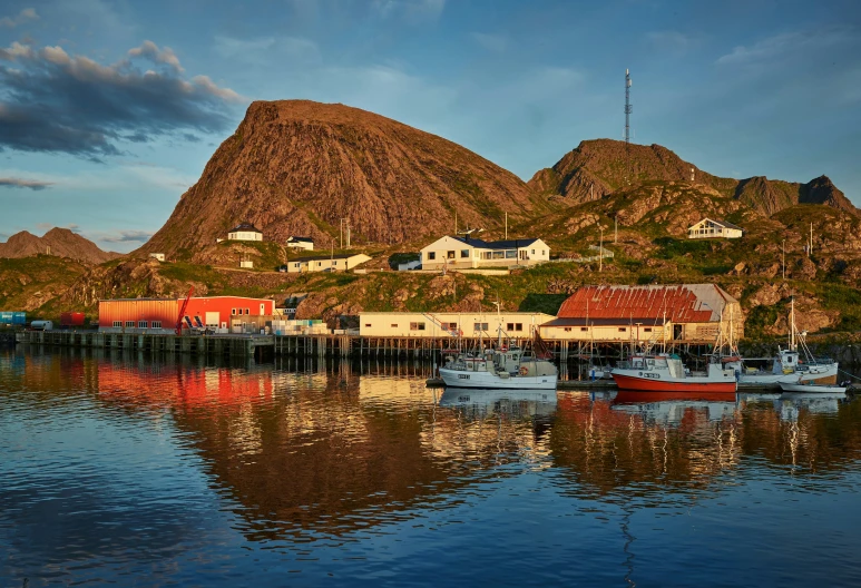 a boat is docked at the dock in a cove