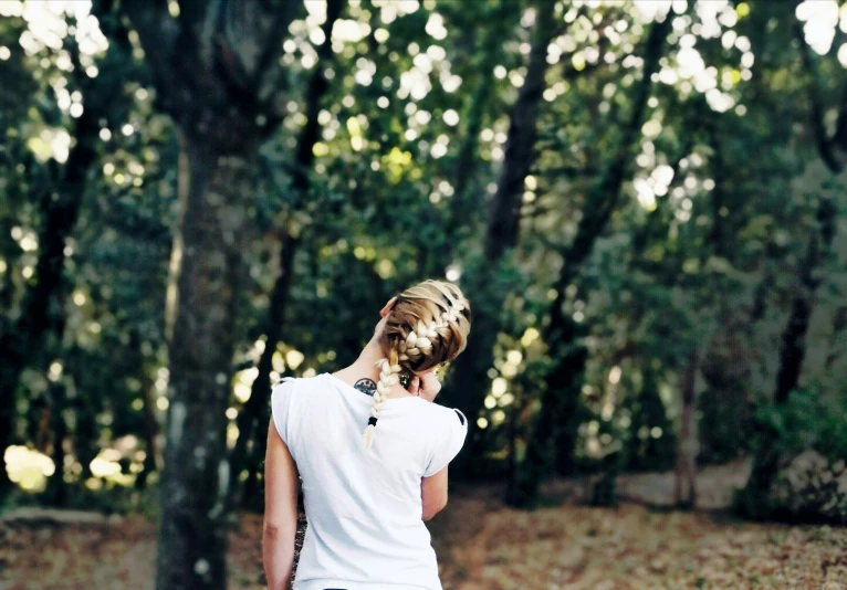 a young woman is talking on the phone