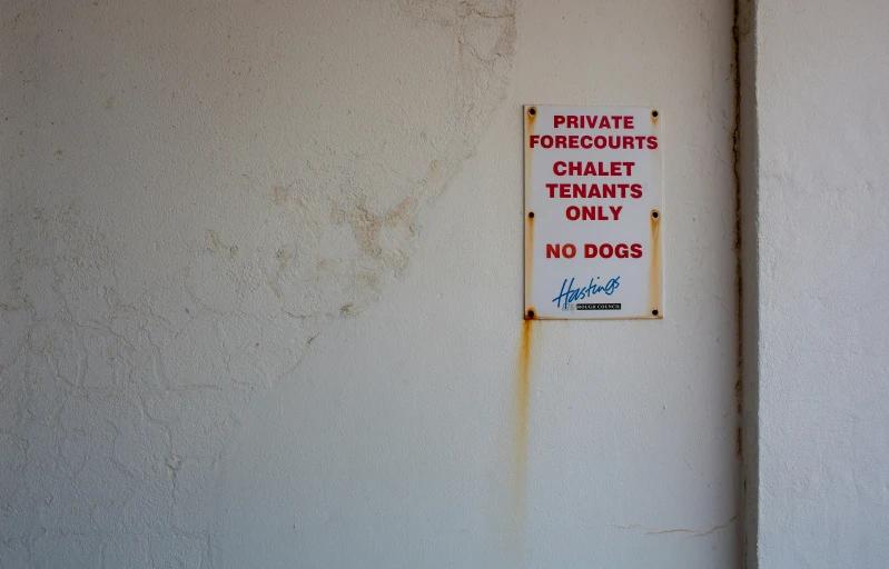 this is a sign that warns dog owners that they only have the animals