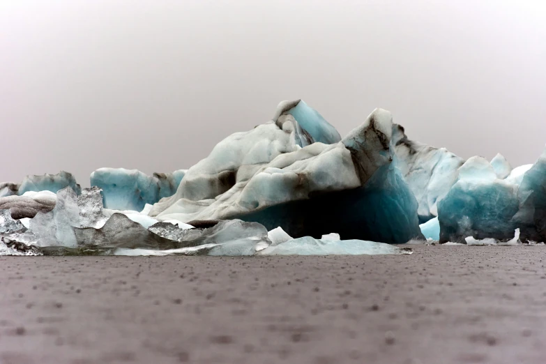 the ice is blue and white with brown patches