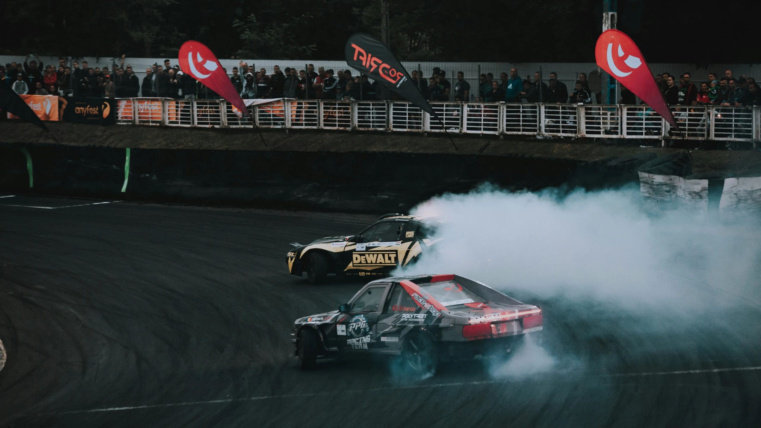 a person riding in a car on a dirt track