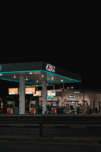 an image of a gas station at night
