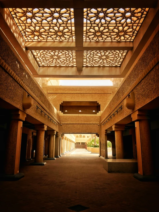 a very long corridor with lots of pillars