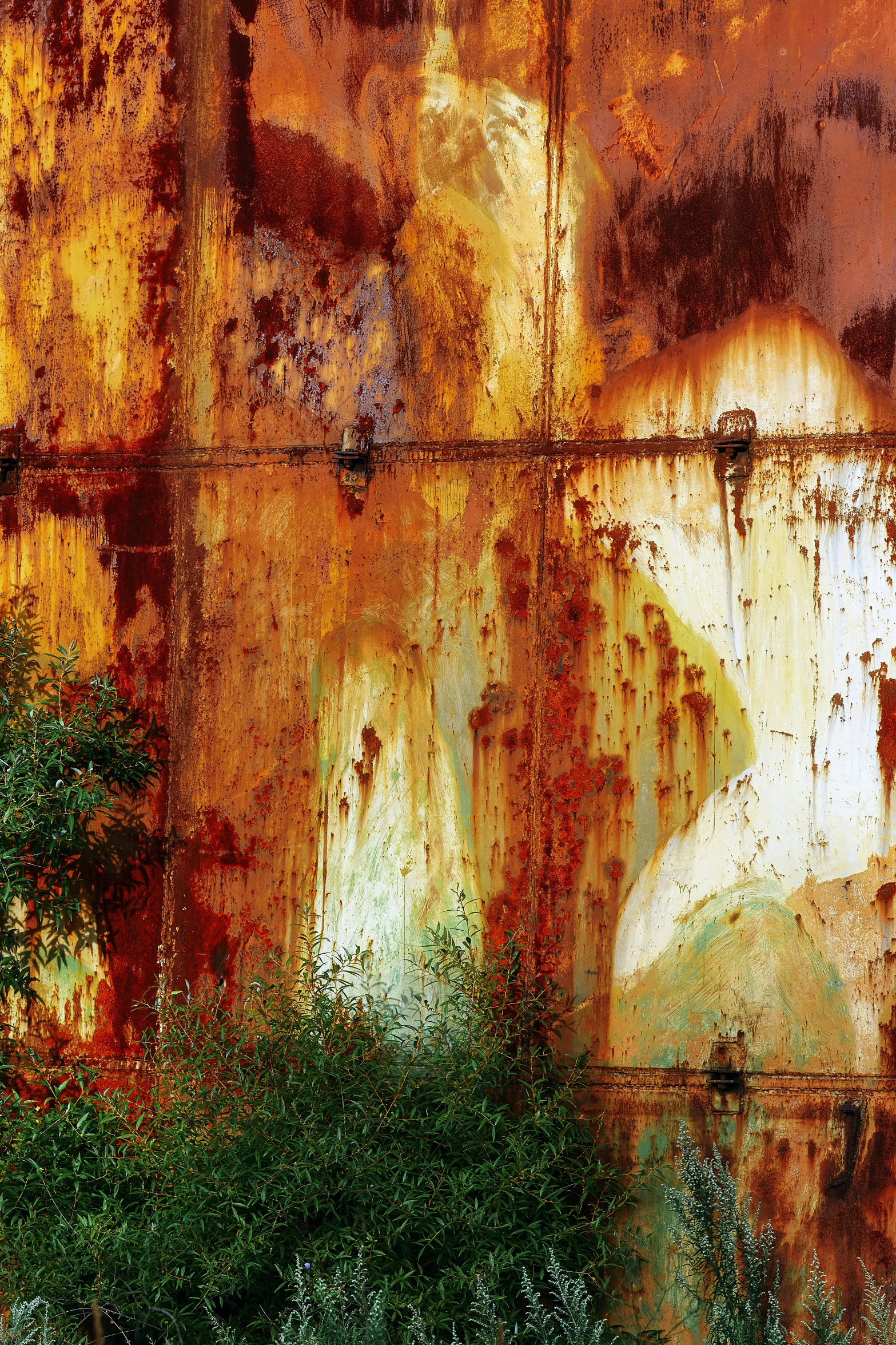 an art work depicting the silhouette of a man on a rusty wall