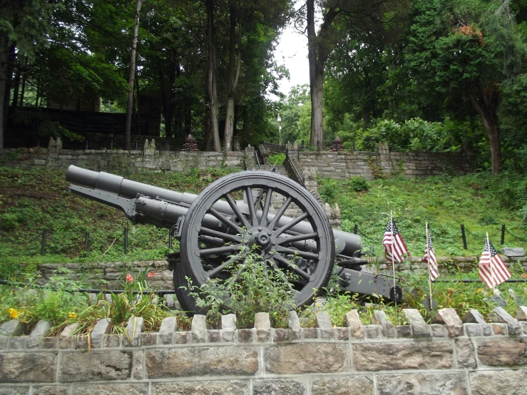 the old gun was knocked down and placed on the stone wall