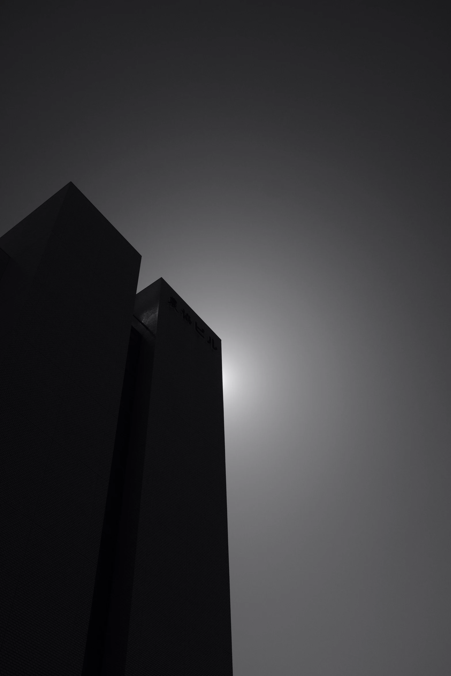 black and white pograph of a dark building