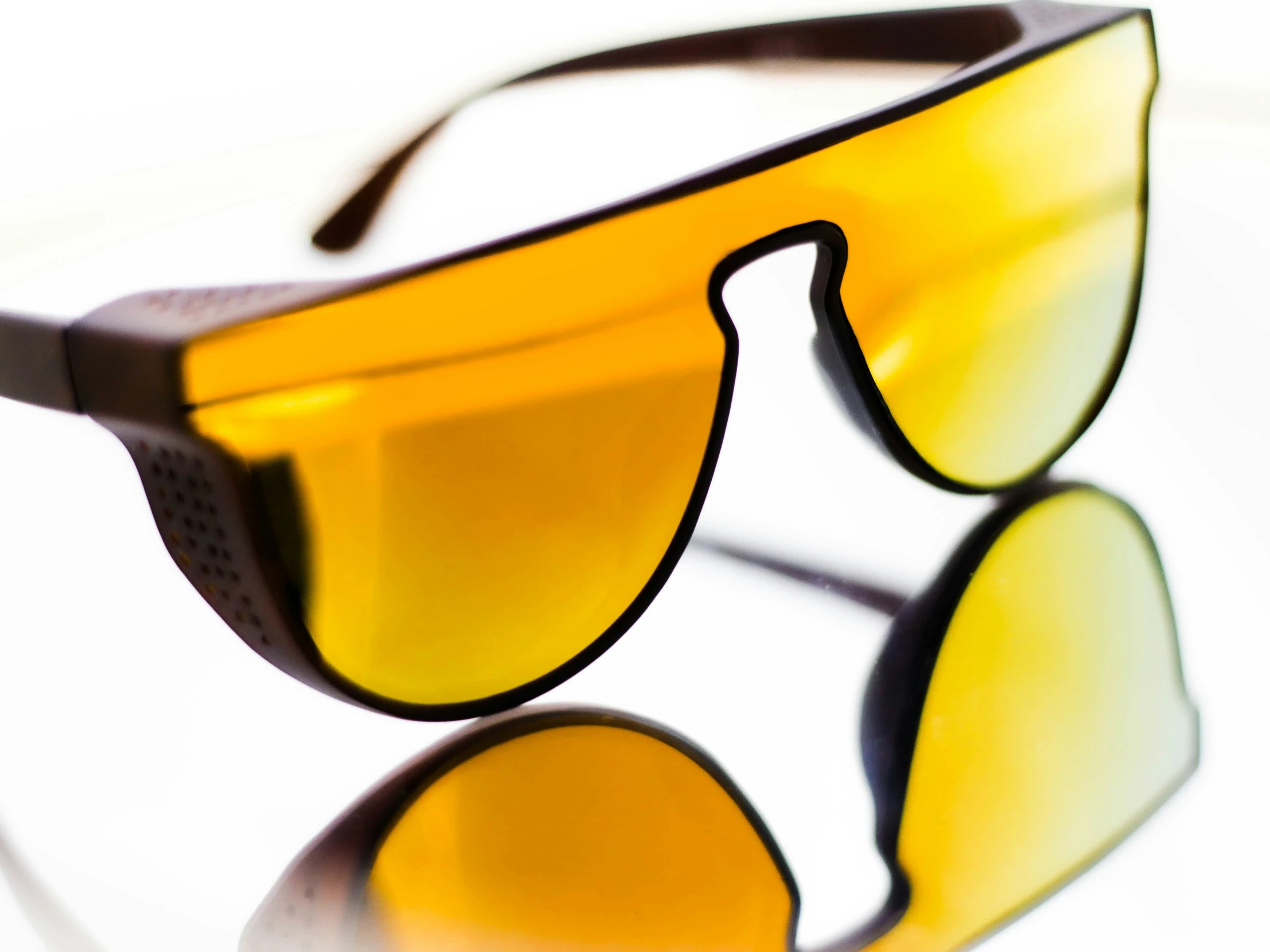 sunglasses, including the reflection of them in water