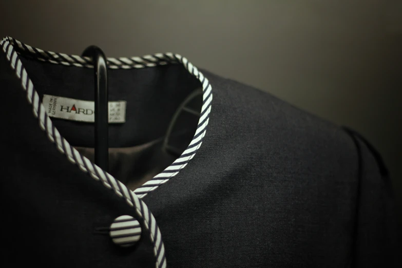 a black and white striped shirt with name tags on it