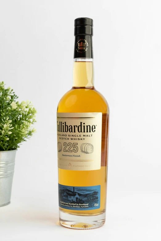 a bottle of libarone next to a plant