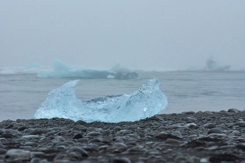 there is a small iceberg that is melting on the water