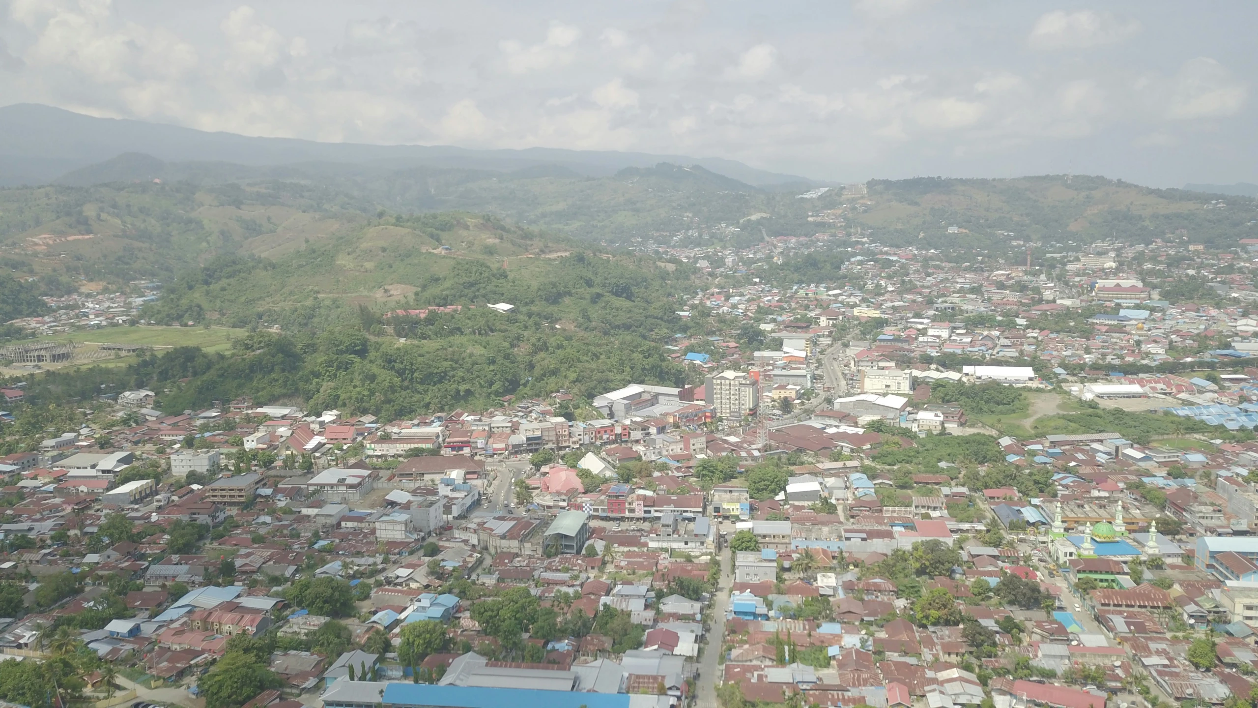 the village in the distance is situated on a hill