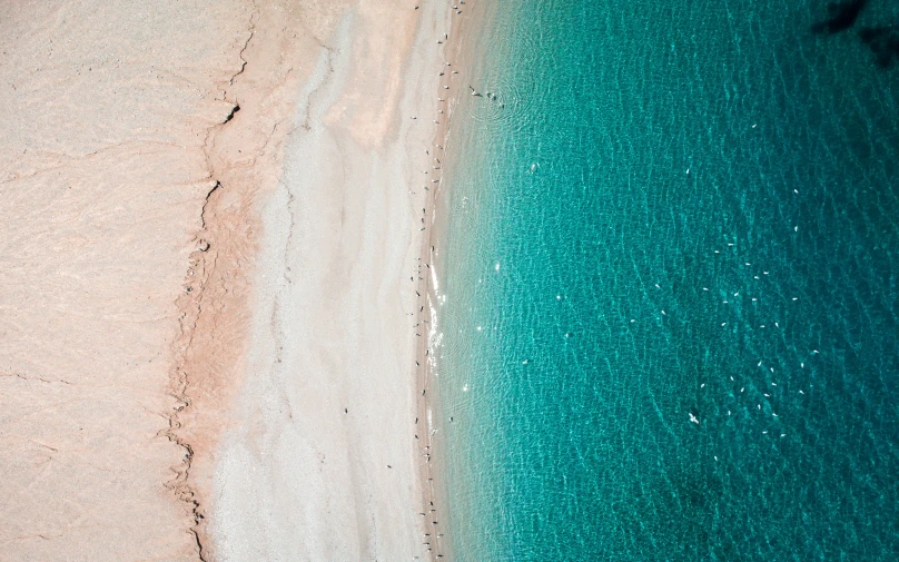 an aerial view of the water and a beach area