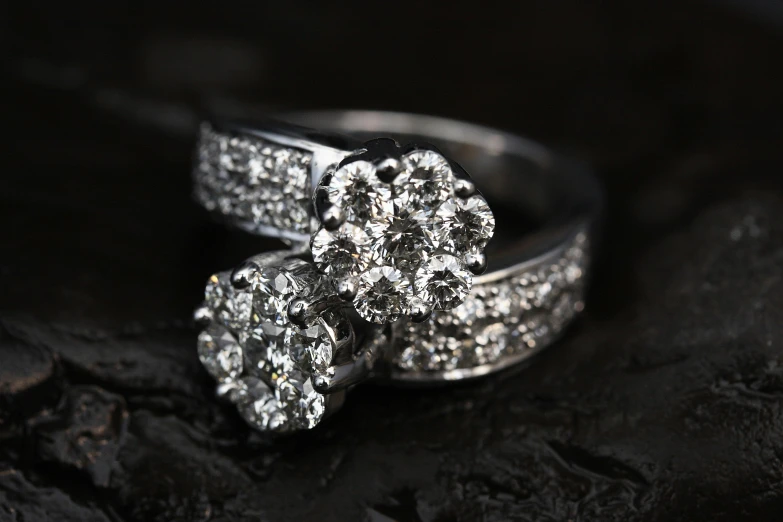 a close up of a wedding set with a fancy ring