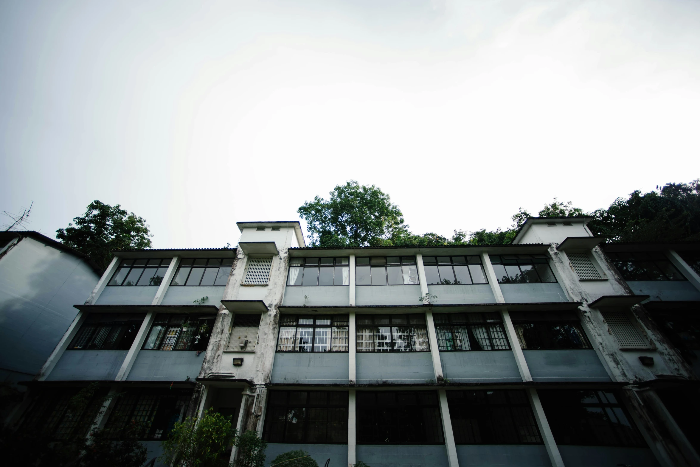 a very tall building with several stories and balconies