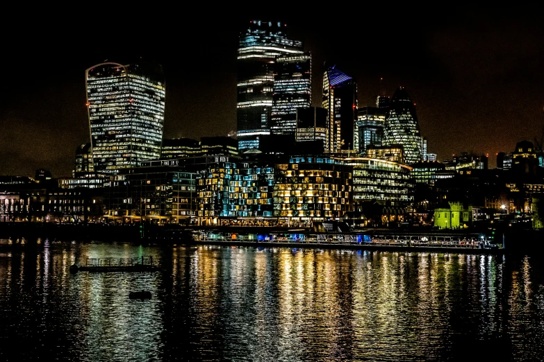 city lights shine brightly over a body of water