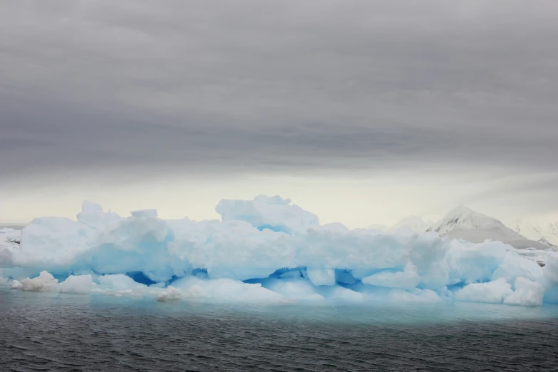 several pieces of ice floating in the water